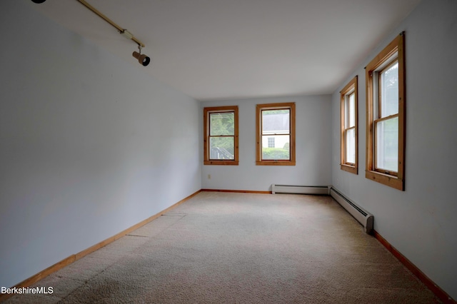 1057 Main St, Great Barrington, MA 01236 - spare room with light carpet, baseboards, and a baseboard radiator