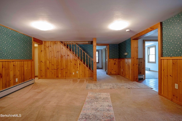 1057 Main St, Great Barrington, MA 01236 - spare room featuring wallpapered walls, a wainscoted wall, a baseboard heating unit, wood walls, and stairway