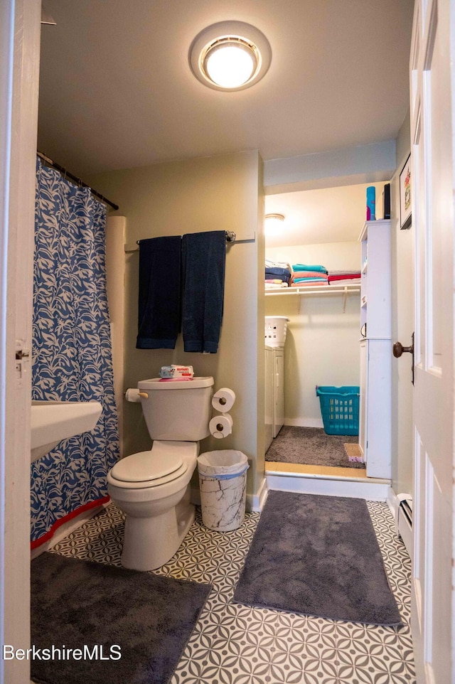 1057 Main St, Great Barrington, MA 01236 - bathroom with toilet, a baseboard radiator, baseboards, and a sink