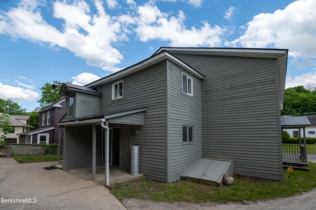 1057 Main St, Great Barrington, MA 01236 - view of side of home with a patio