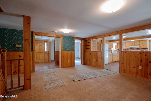 1057 Main St, Great Barrington, MA 01236 - empty room with wallpapered walls, a wainscoted wall, wooden walls, carpet flooring, and a baseboard heating unit