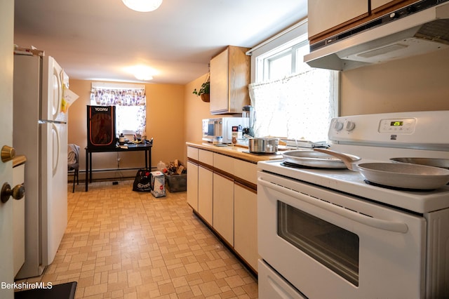 1057 Main St, Great Barrington, MA 01236 - kitchen with white appliances, under cabinet range hood, light flooring, and light countertops