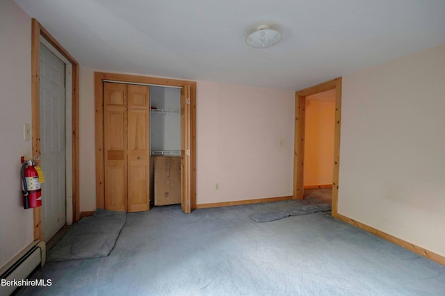 1057 Main St, Great Barrington, MA 01236 - unfurnished bedroom featuring baseboard heating, light colored carpet, a closet, and baseboards