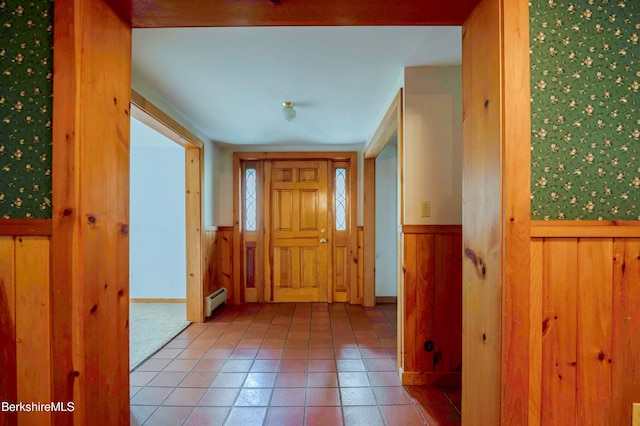1057 Main St, Great Barrington, MA 01236 - tiled foyer entrance featuring baseboard heating, a wainscoted wall, and wood walls