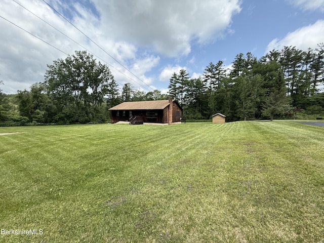153 Dugway Rd, Lenox, MA 01240 - view of grassy yard with a storage unit