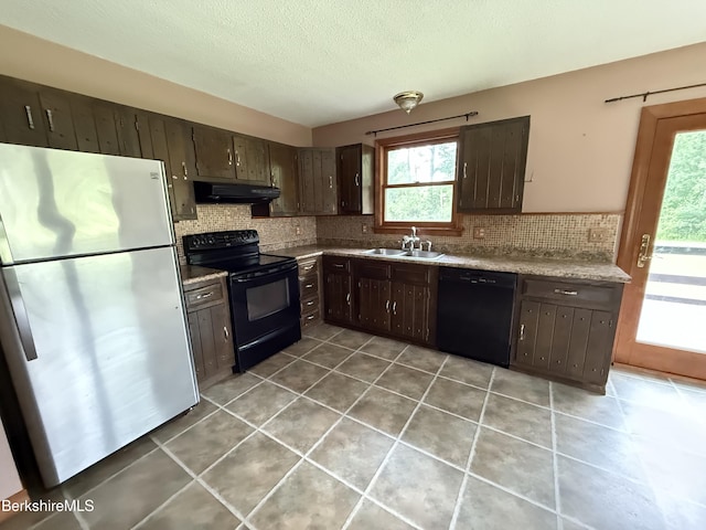 153 Dugway Rd, Lenox, MA 01240 - kitchen with black appliances, under cabinet range hood, backsplash, dark brown cabinets, and light tile patterned flooring