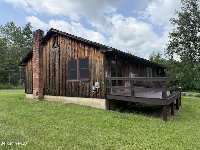 153 Dugway Rd, Lenox, MA 01240 - back of house with a chimney, a yard, a wooden deck, and board and batten siding