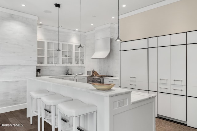 kitchen featuring decorative light fixtures and white cabinets