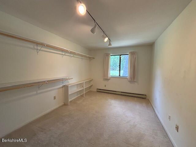 53 Churchill Crst Unit 53, Pittsfield, MA 01201 - walk in closet with a baseboard heating unit and carpet flooring