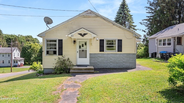 85 Wilson St, Pittsfield, MA 01201 - view of front of house featuring stone siding and a front lawn