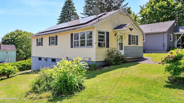 85 Wilson St, Pittsfield, MA 01201 - bungalow-style house featuring solar panels, a front yard, and stone siding