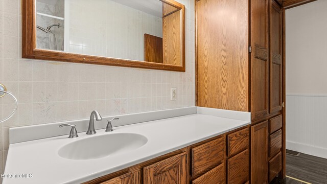 85 Wilson St, Pittsfield, MA 01201 - full bathroom featuring vanity, wood finished floors, and wainscoting