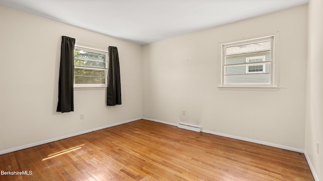 85 Wilson St, Pittsfield, MA 01201 - unfurnished room with a baseboard radiator and light wood-style flooring