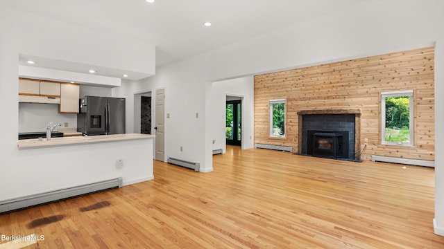 889 George Carter Rd, Becket, MA 01223 - unfurnished living room featuring light wood-style flooring, a baseboard heating unit, a baseboard radiator, and recessed lighting
