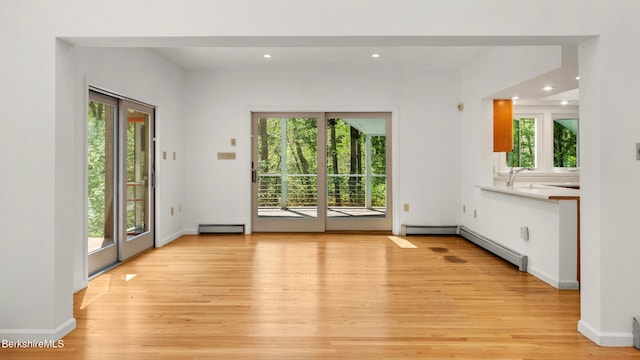 889 George Carter Rd, Becket, MA 01223 - unfurnished living room with healthy amount of natural light, light wood finished floors, and recessed lighting