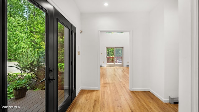 889 George Carter Rd, Becket, MA 01223 - doorway to outside featuring baseboard heating, light wood-type flooring, recessed lighting, and french doors