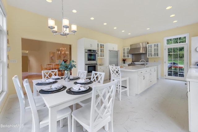 dining space with an inviting chandelier