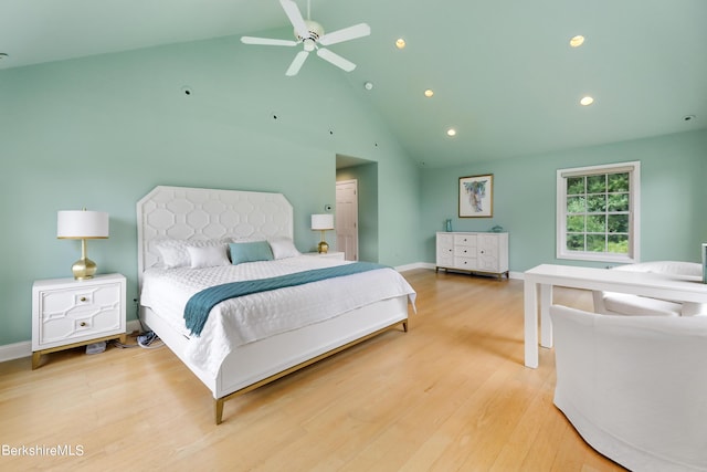 bedroom featuring light wood-type flooring, ceiling fan, and lofted ceiling