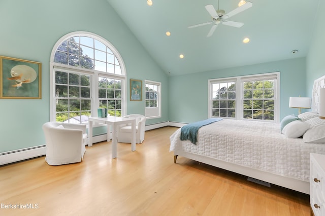 bedroom with ceiling fan, high vaulted ceiling, a baseboard radiator, and light wood-type flooring