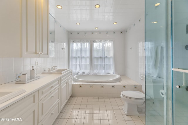 full bathroom featuring decorative backsplash, vanity, separate shower and tub, tile patterned flooring, and toilet