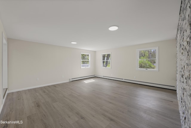 149 Wilshire Dr, Cheshire, MA 01225 - unfurnished room with wood finished floors, baseboards, and a baseboard heating unit