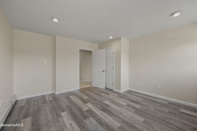 149 Wilshire Dr, Cheshire, MA 01225 - empty room featuring baseboards, baseboard heating, and wood finished floors