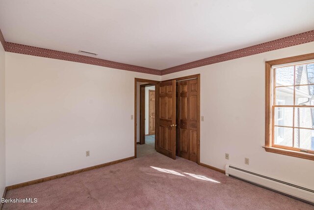 1166 Rannapo Rd, Sheffield, MA 01257 - unfurnished bedroom featuring a baseboard heating unit, light carpet, baseboards, and a closet