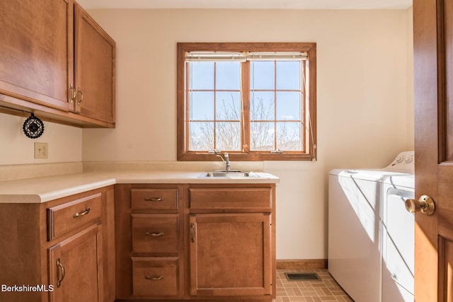 1166 Rannapo Rd, Sheffield, MA 01257 - washroom with washer and clothes dryer, cabinet space, baseboards, and brick patterned floors