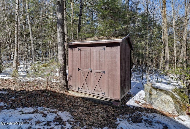 305 Shadow Ln, Sandisfield, MA 01255 - snow covered structure featuring a shed and a view of trees