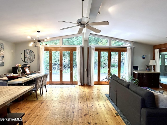 305 Shadow Ln, Sandisfield, MA 01255 - living room featuring french doors, light wood-style floors, ceiling fan, vaulted ceiling, and a chandelier