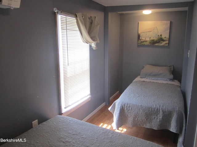 bedroom with light wood-type flooring