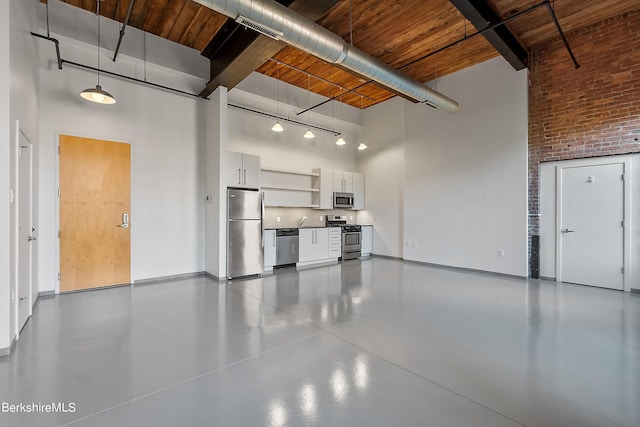 garage featuring stainless steel refrigerator and wood ceiling