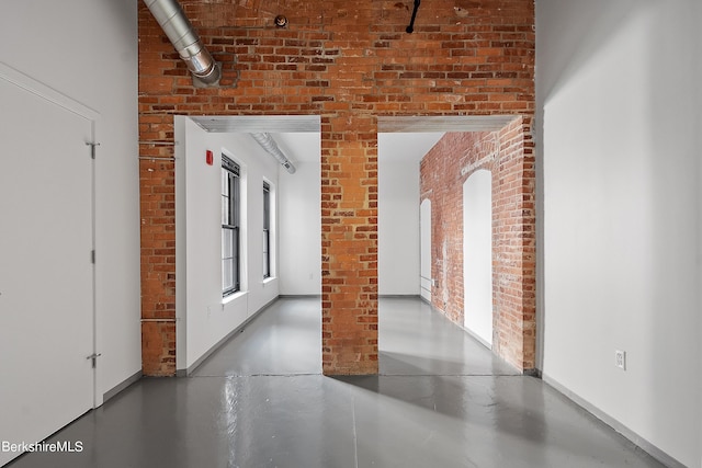 hallway with brick wall