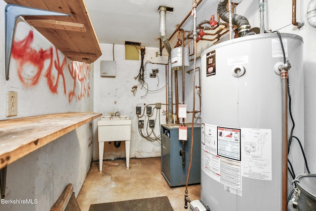 utilities featuring water heater, a heating unit, and a sink