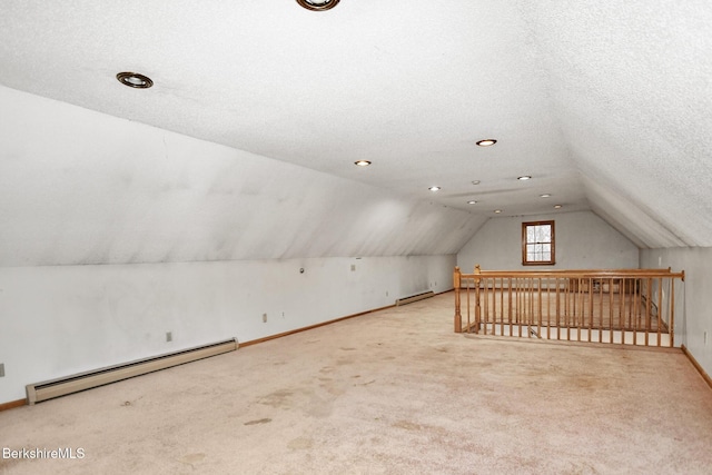 bonus room with lofted ceiling, baseboard heating, a baseboard heating unit, carpet flooring, and a textured ceiling