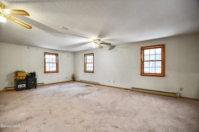 unfurnished room featuring a ceiling fan, a baseboard radiator, and carpet flooring