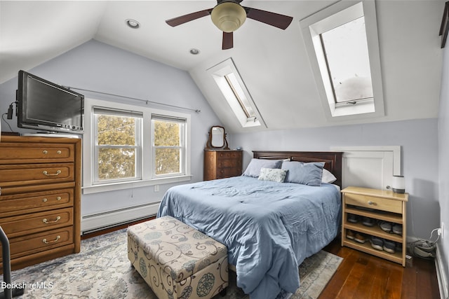 bedroom featuring vaulted ceiling with skylight, ceiling fan, dark hardwood / wood-style floors, and baseboard heating