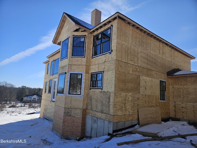 view of snow covered property