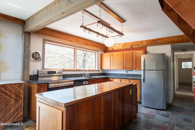 207-209 Main St, Becket, MA 01223 - kitchen featuring butcher block countertops, stone finish floor, a center island, a sink, and appliances with stainless steel finishes