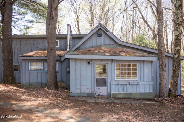 207-209 Main St, Becket, MA 01223 - rear view of house with board and batten siding