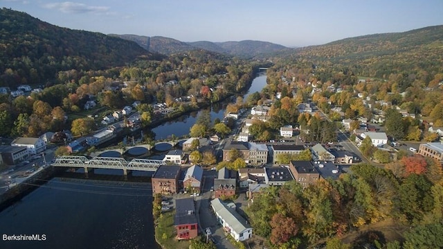 aerial view featuring a water and mountain view