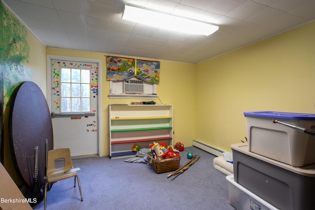 game room featuring cooling unit, carpet, and a baseboard heating unit