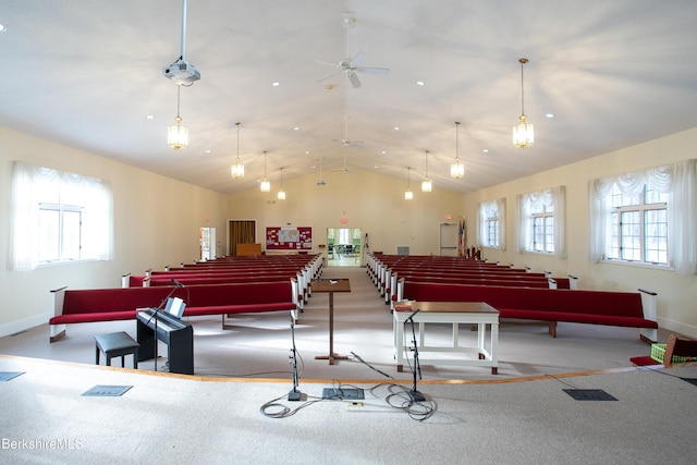 misc room with ceiling fan, a healthy amount of sunlight, carpet floors, and high vaulted ceiling