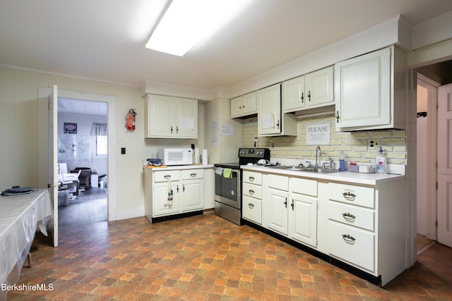 kitchen featuring tasteful backsplash, ornamental molding, stainless steel electric stove, sink, and white cabinetry