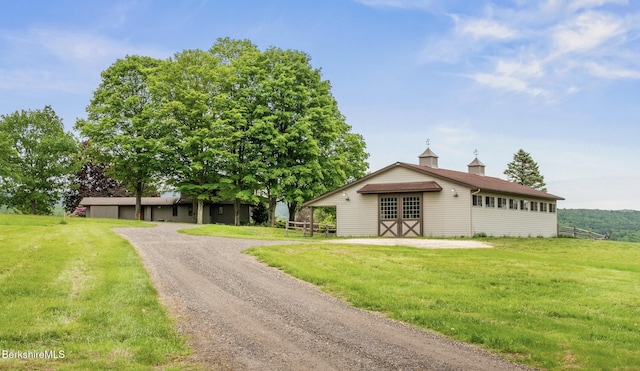 21 Kalliste Hl, Great Barrington, MA 01230 - view of front facade with a front lawn and dirt driveway