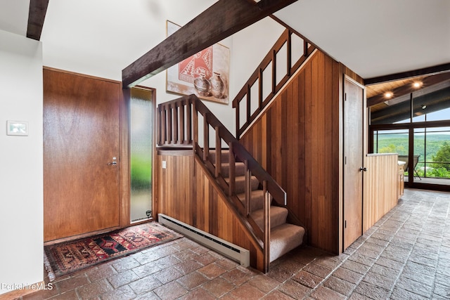 21 Kalliste Hl, Great Barrington, MA 01230 - entrance foyer with a baseboard radiator, stairway, wooden walls, and stone tile flooring