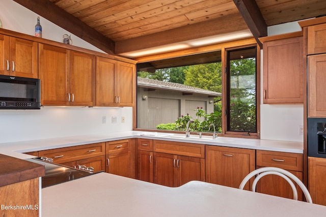 21 Kalliste Hl, Great Barrington, MA 01230 - kitchen featuring black microwave, a sink, brown cabinets, wooden ceiling with exposed beams, and light countertops