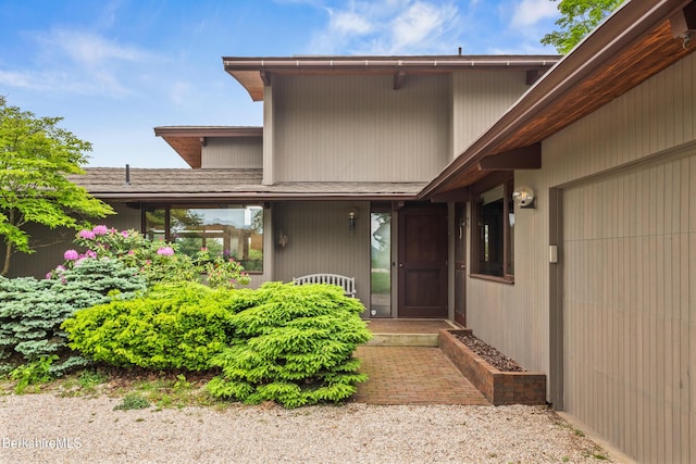 21 Kalliste Hl, Great Barrington, MA 01230 - doorway to property featuring a garage and roof with shingles
