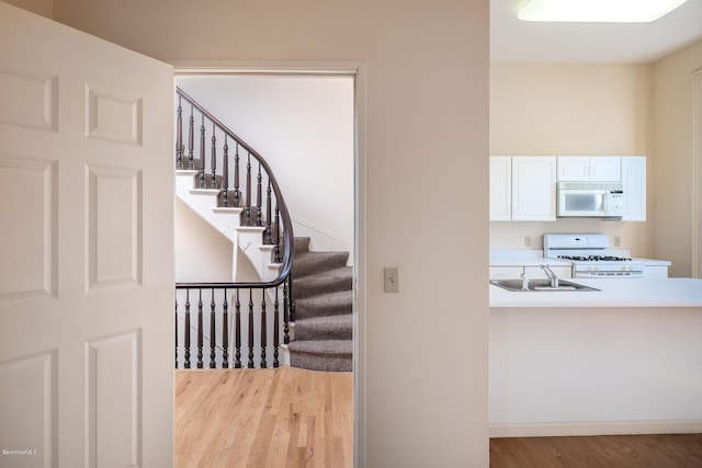36 Holden St Unit A, North Adams, MA 01247 - stairway featuring wood finished floors and baseboards