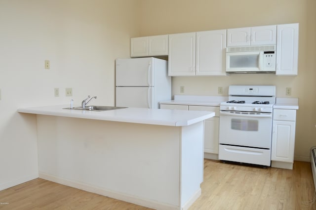 36 Holden St Unit A, North Adams, MA 01247 - kitchen featuring white appliances, a peninsula, light wood-style flooring, white cabinetry, and light countertops